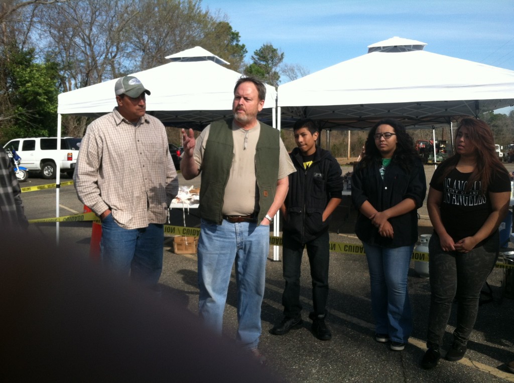 Scott Hamilton gives a charge to the volunteers before the prayer time at ShadeTree