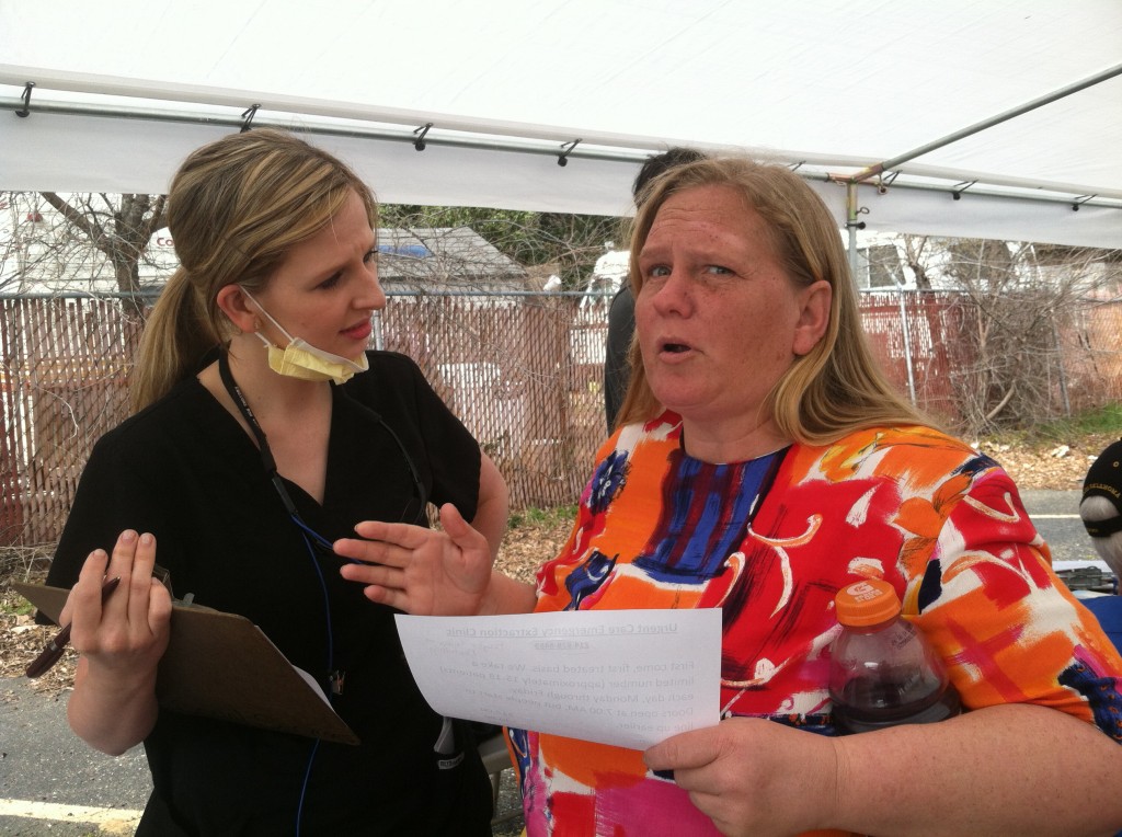 Katlynn Kennedy from Baylor School of dentistry volunteers her time to check the oral health of our ShadeTree Fellowship